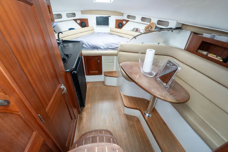 Slide: The Image of 2007 Pro-Line 35 Express cabin interior with wood accents and cozy seating area. - 15