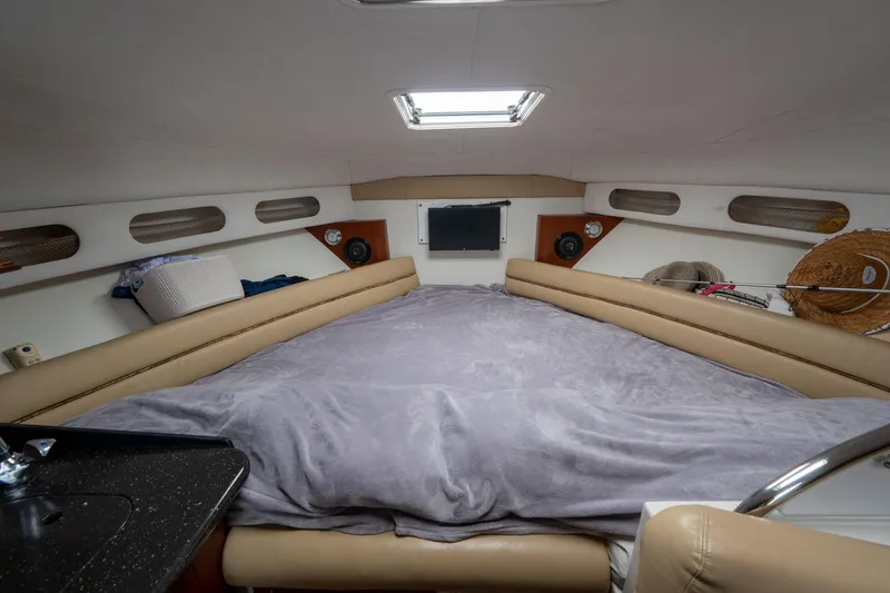 Slide: The Image of 2007 Pro-Line 35 Express cabin interior with cozy bed and modern amenities. - 16