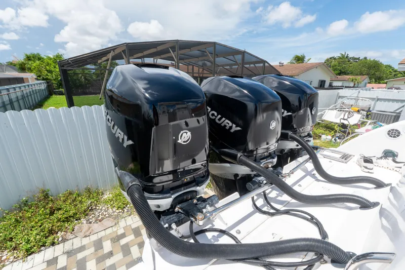 Slide: The Image of Triple Mercury outboard engines on a 2007 Pro-Line 35 Express boat. - 4