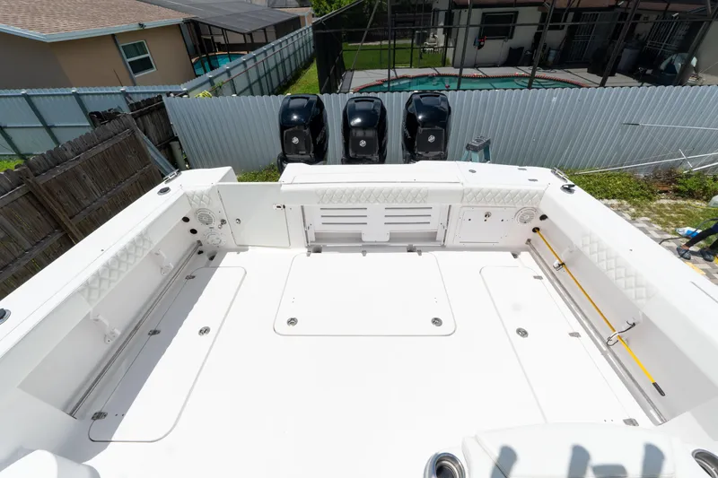 Slide: The Image of 2007 Pro-Line 35 Express boat deck with triple outboard motors, viewed from above. - 8