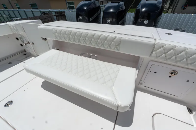 Slide: The Image of 2007 Pro-Line 35 Express boat with white cushioned seating and Mercury engines. - 9