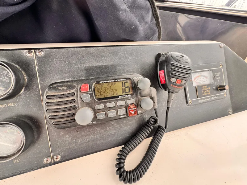 Slide: The Image of Control panel of a 1985 Symbol 51 Cockpit Motor Yacht with radio equipment. - 28