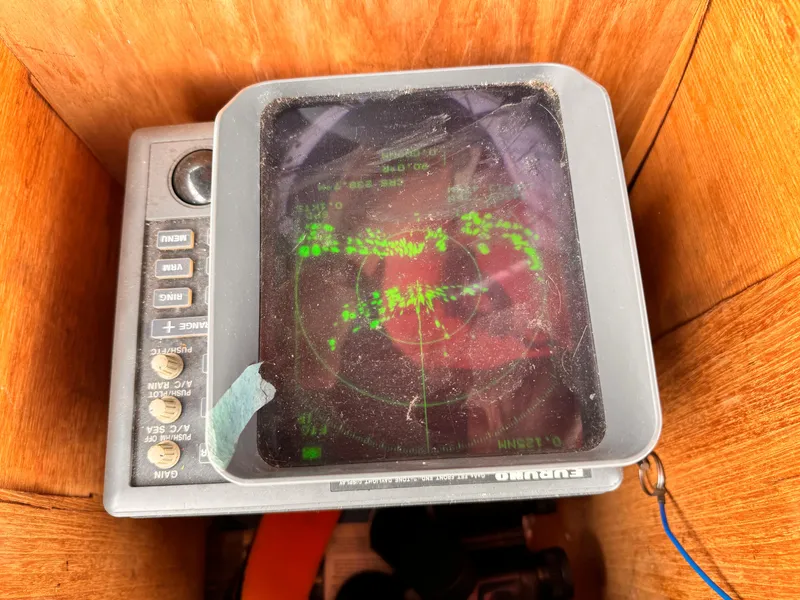 Slide: The Image of 1985 Symbol 51 Cockpit Motor Yacht radar display with green navigation screen. - 30