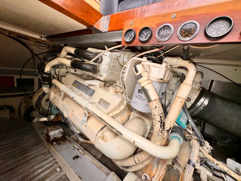 Slide: The Image of Engine room of 1985 Symbol 51 Cockpit Motor Yacht with gauges and piping. - 34