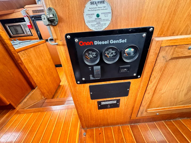 Slide: The Image of Control panel of a 1985 Symbol 51 Cockpit Motor Yacht with Onan Diesel GenSet. - 36