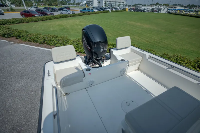 Slide: The Image of The image shows the stern of a Boston Whaler 190 Montauk with an outboard motor. - 24