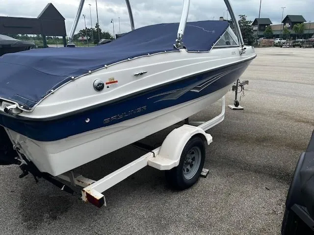 Slide: The Image of 2010 Bayliner 185S Bow Rider dashboard with steering wheel and instrument panel. - 2