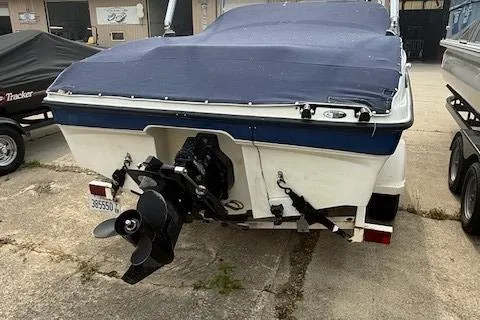 Slide: The Image of 2010 Bayliner 185S Bow Rider on trailer, parked outdoors. - 7