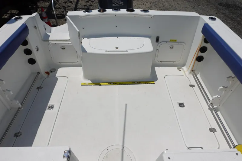 Slide: The Image of 2004 Polar 2300 Walkaround boat interior with spacious deck and storage compartments. - 12