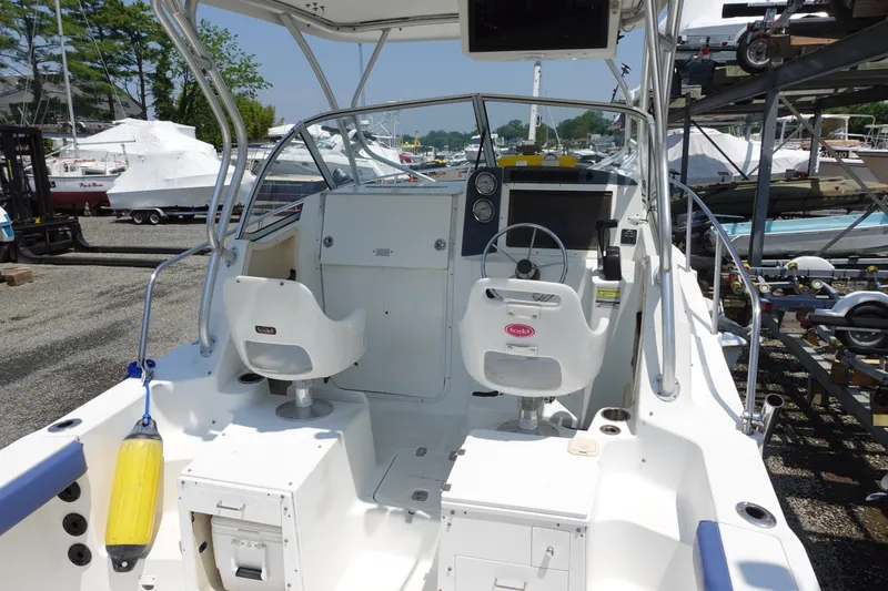 Slide: The Image of 2004 Polar 2300 Walkaround boat interior with dual seats and steering wheel. - 6