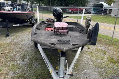 Slide: The Image of 2022 SeaArk 1648 Slayer boat on trailer, parked outdoors. - 3