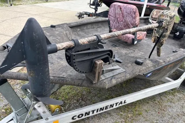 Slide: The Image of 2022 SeaArk 1648 Slayer boat on Continental trailer with camouflage seats and trolling motor. - 6