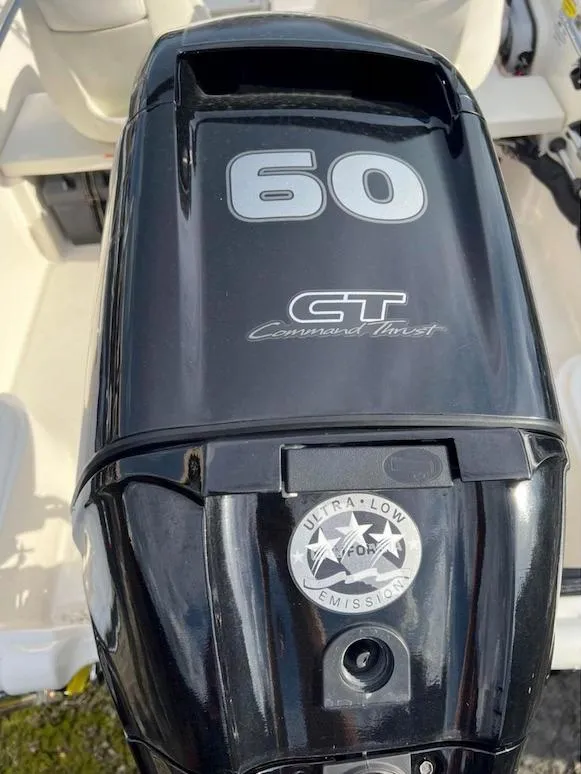 Slide: The Image of Outboard motor on a 2018 Boston Whaler 150 Super Sport, featuring 60 HP Command Thrust. - 7