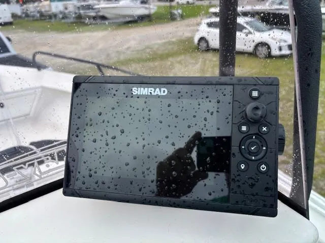 Slide: The Image of Simrad marine display on May-Craft 1800 Skiff, 2021, with raindrops on screen. - 13