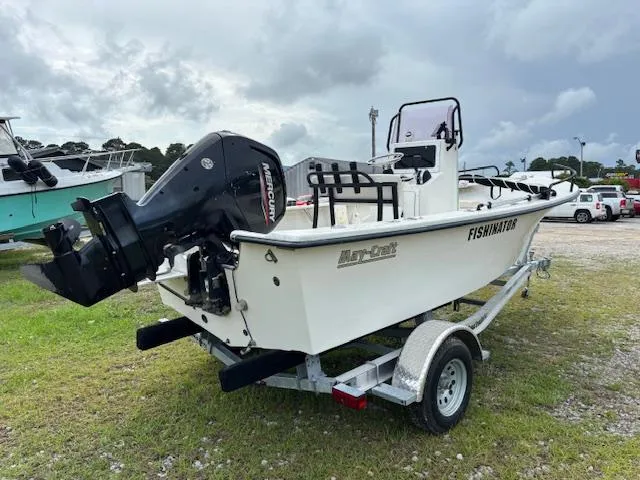 Slide: The Image of 2021 May-Craft 1800 Skiff boat on trailer, featuring Mercury outboard motor. - 6