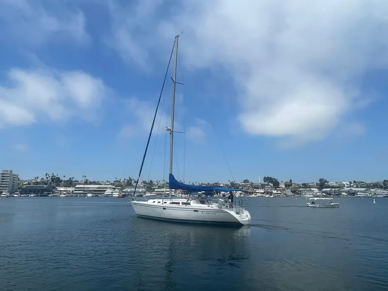 Slide: The Image of Sailboat Catalina 42 MkII 1999 on calm water under a blue sky. - 0