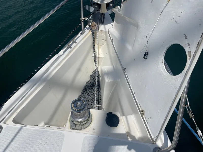Slide: The Image of Anchor locker of a 1999 Catalina 42 MkII sailboat with chain and windlass. - 2