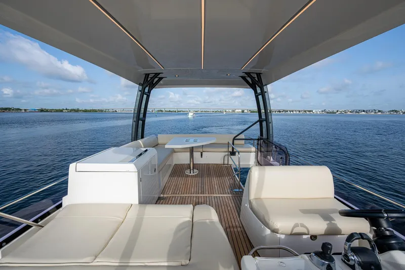 Slide: The Image of Luxurious 2019 Prestige 460 yacht interior with spacious seating and ocean view. - 33