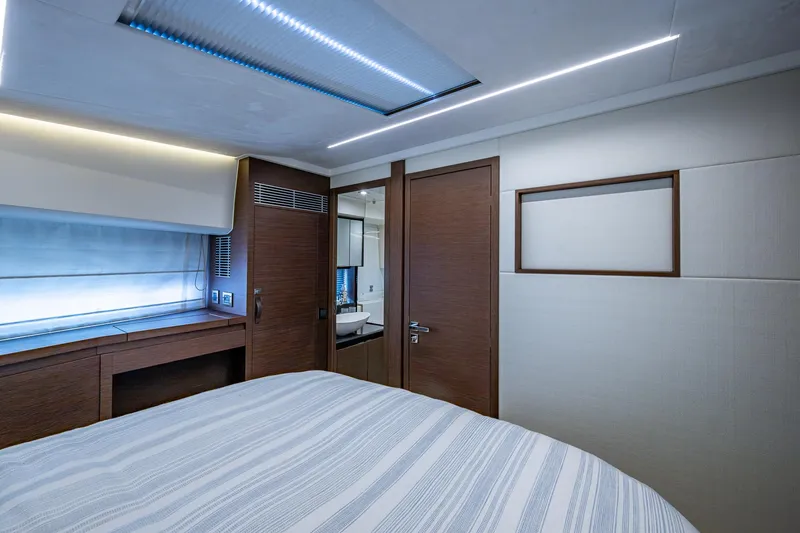 Slide: The Image of Luxurious interior of a 2019 Prestige 460 yacht cabin with modern design and ambient lighting. - 42