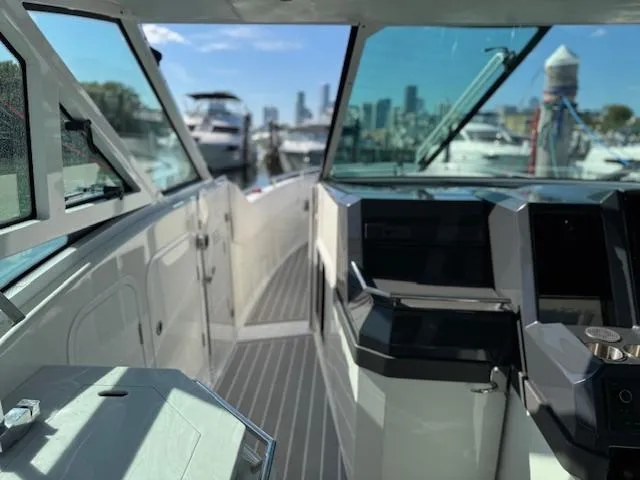Slide: The Image of 2022 Formula 430 Super Sport Crossover boat interior with city skyline in background. - 17