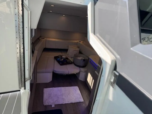 Slide: The Image of Interior view of 2022 Formula 430 Super Sport Crossover, featuring a cozy seating area. - 27