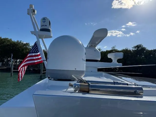 Slide: The Image of 2022 Formula 430 Super Sport Crossover yacht with radar and American flag, sunny day. - 3