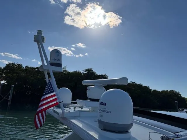 Slide: The Image of 2022 Formula 430 Super Sport Crossover boat with radar, American flag, and sunny sky. - 4