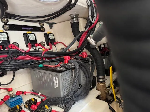 Slide: The Image of 2022 Formula 430 Super Sport Crossover engine compartment with battery and wiring. - 42