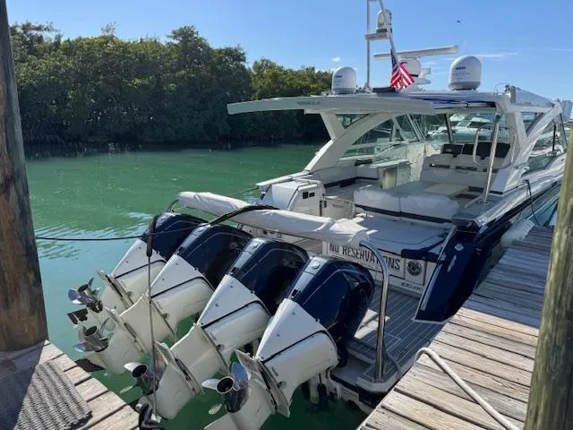 Slide: The Image of 2022 Formula 430 Super Sport Crossover docked with four powerful outboard engines. - 45