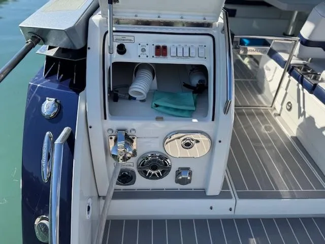 Slide: The Image of 2022 Formula 430 Super Sport Crossover boat deck with storage compartment open. - 5