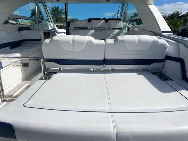 Slide: The Image of 2022 Formula 430 Super Sport Crossover boat interior with luxurious white seating. - 7
