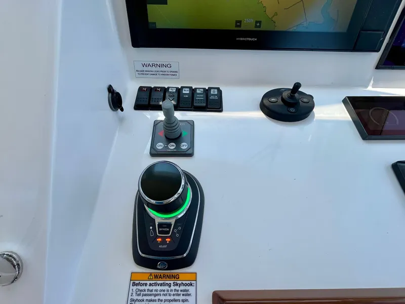 Slide: The Image of Control panel of a 2019 MJM 35z boat with navigation and joystick controls. - 32