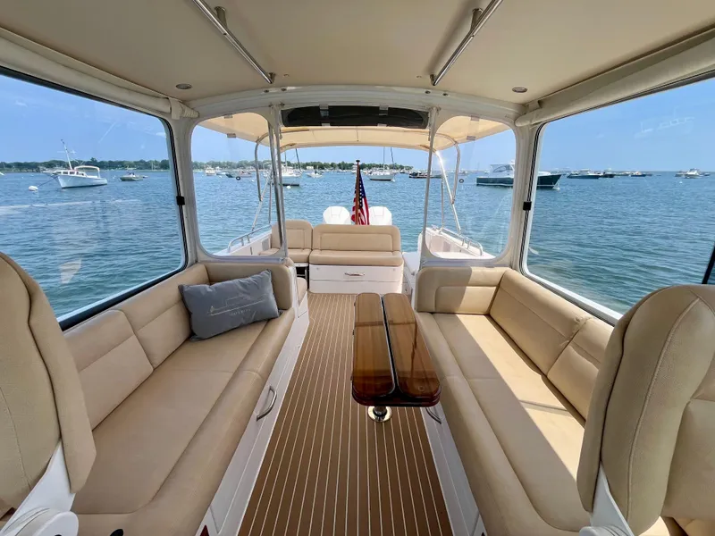 Slide: The Image of Luxurious interior of 2019 MJM 35z yacht with beige seating and scenic ocean view. - 23