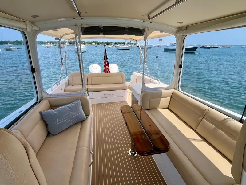 Slide: The Image of Luxurious interior of 2019 MJM 35z yacht with beige seating and wooden flooring. - 22