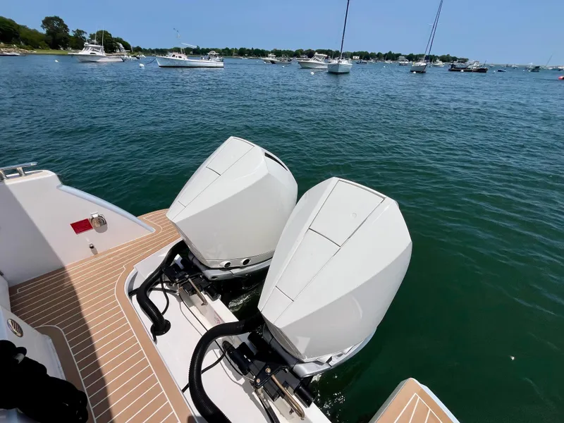 Slide: The Image of 2019 MJM 35z boat with dual outboard engines on a sunny day. - 5