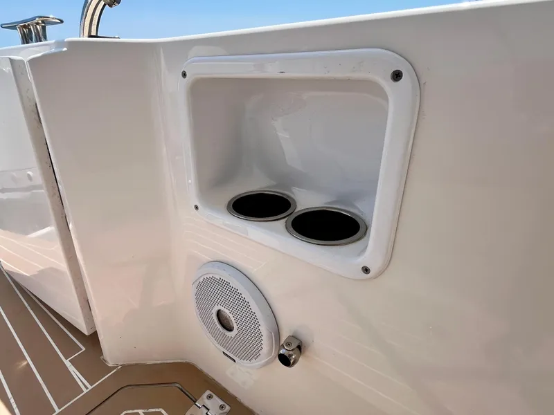 Slide: The Image of 2019 MJM 35z boat interior with cup holders and speaker on deck. - 50