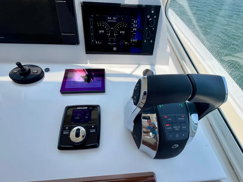 Slide: The Image of Helm controls of a 2019 MJM 35z boat with navigation display. - 33