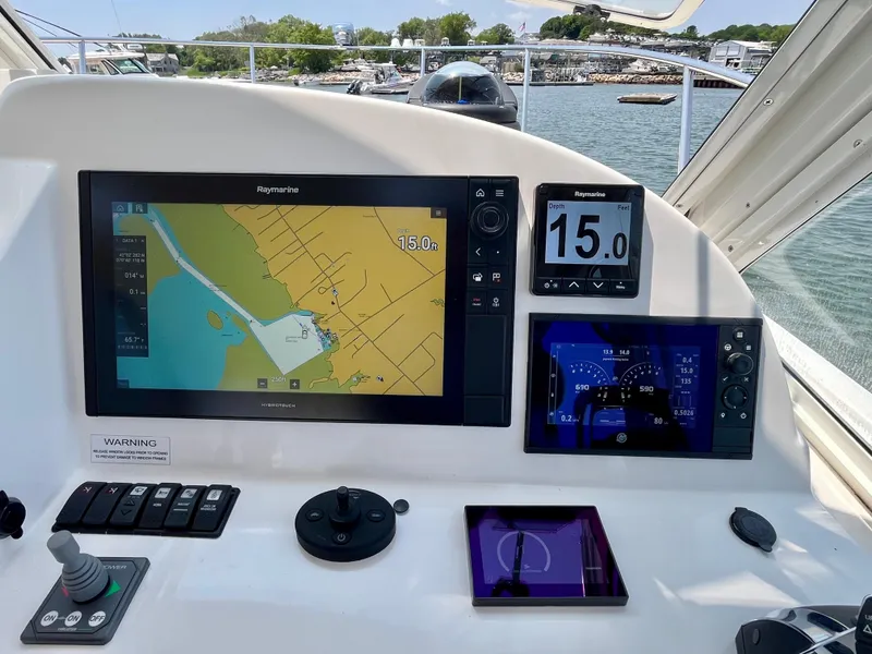 Slide: The Image of 2019 MJM 35z boat dashboard with navigation screens and controls. - 34