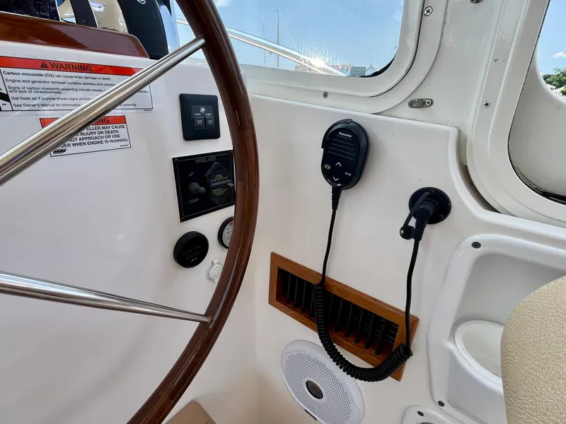 Slide: The Image of Helm of 2019 MJM 35z boat with steering wheel and communication equipment. - 31