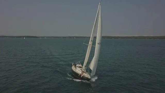 Slide: The Image of Sailing yacht Hinckley Sou'wester 42, 1987 model, cruising on open water. - 12