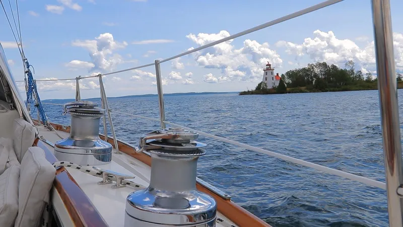 Slide: The Image of Sailing on 1987 Hinckley Sou'wester 42 near a picturesque lighthouse on a sunny day. - 3