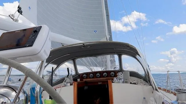 Slide: The Image of Sailing on a 1987 Hinckley Sou'wester 42 yacht under clear skies. - 6