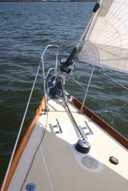 Slide: The Image of Hinckley Bermuda 40 sailboat deck, 1967 model, sailing on open water. - 9