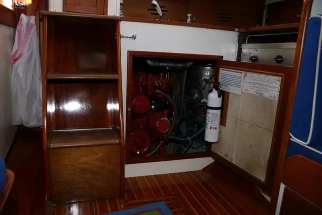 Slide: The Image of Engine compartment of a 1967 Hinckley Bermuda 40 sailboat with wooden interior. - 15
