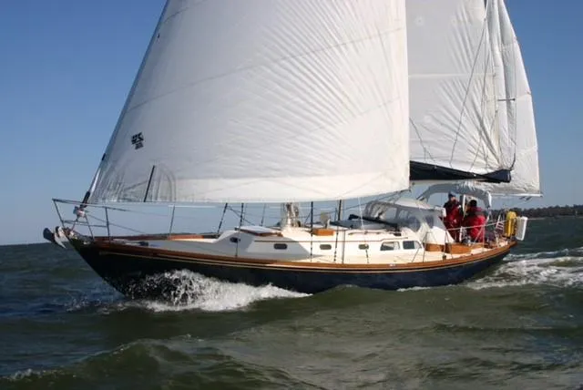 Slide: The Image of Sailing yacht Hinckley Bermuda 40, 1967 model, gliding on open water. - 2