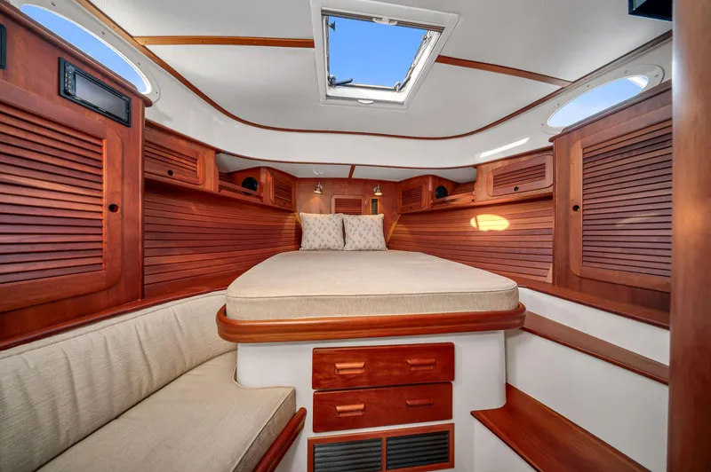 Slide: The Image of 2014 Hinckley Picnic Boat 37 MKIII cabin with wood paneling and skylight. - 8