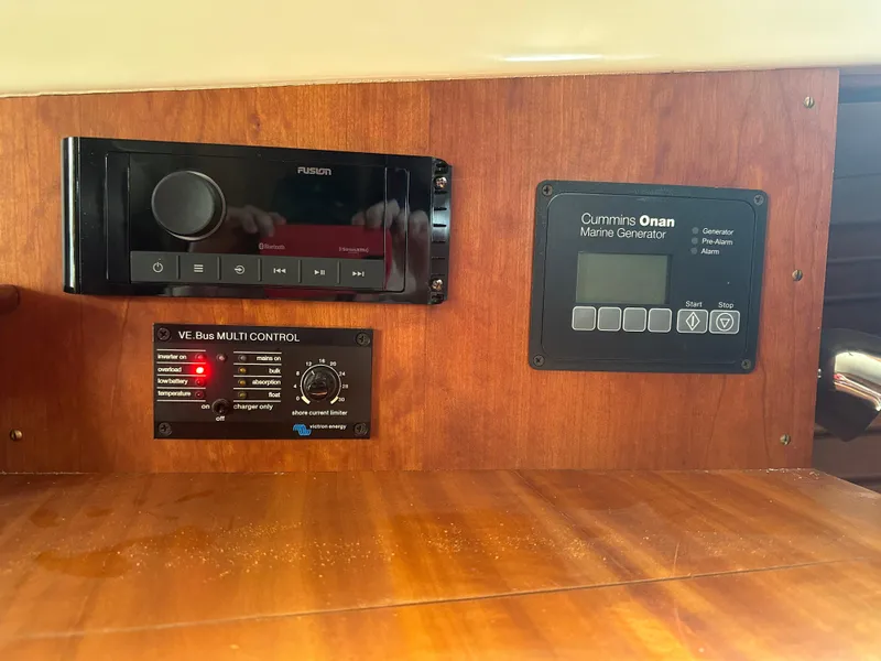 Slide: The Image of Control panel of a 2009 Hinckley Picnic Boat 37 MKIII with audio and generator systems. - 6