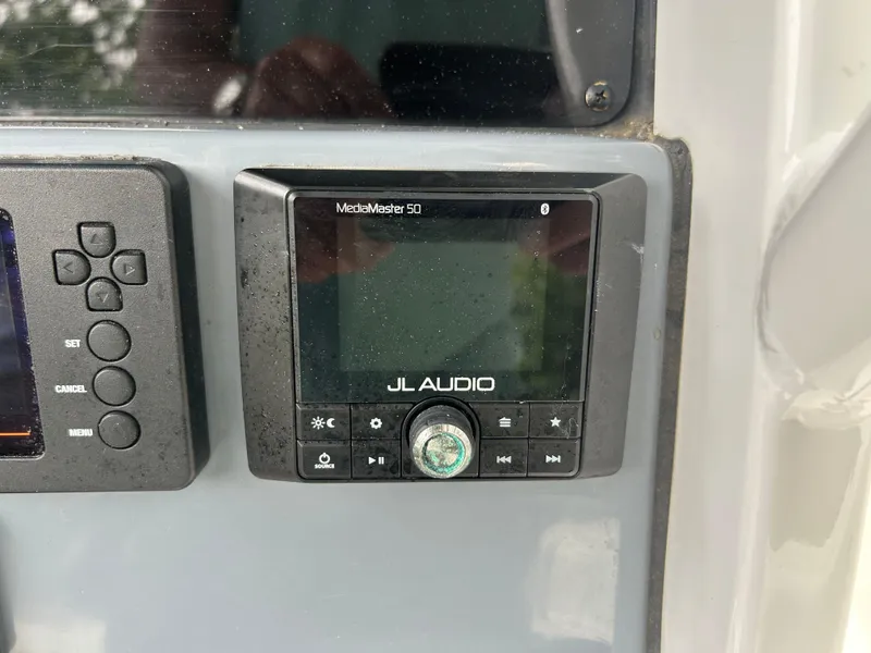 Slide: The Image of Control panel of a 2020 Tidewater 272 CC Adventure with JL Audio system. - 12