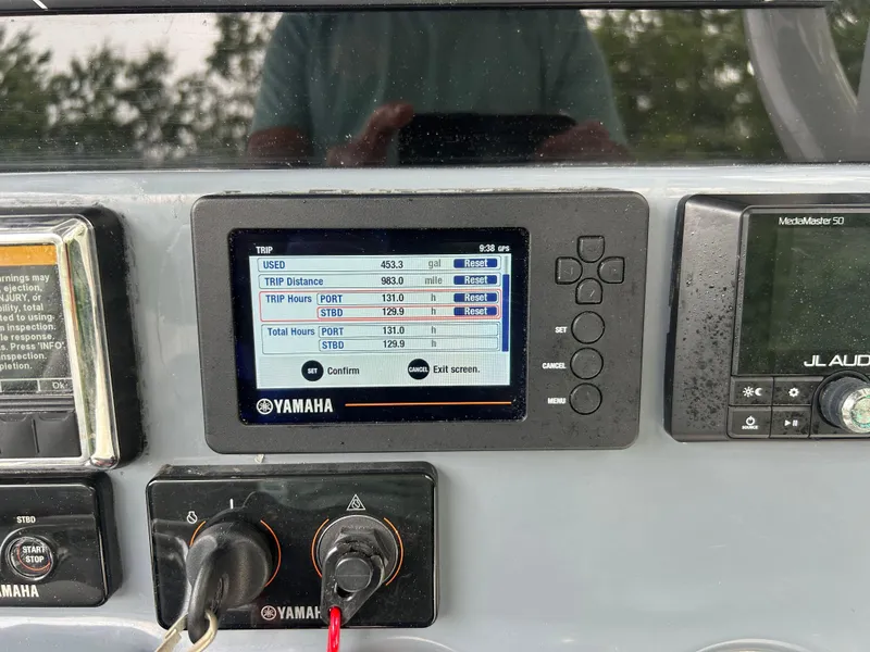Slide: The Image of Yamaha display on 2020 Tidewater 272 CC Adventure boat dashboard showing trip data. - 17