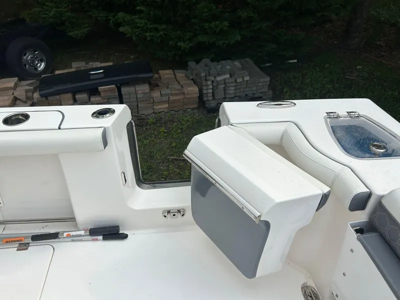 Slide: The Image of 2020 Tidewater 272 CC Adventure boat interior with seating and storage compartments. - 4